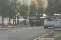Elementos de la policía municipal de Tultitlán resguardan la zona donde fueron localizadas bolsas con restos humanos