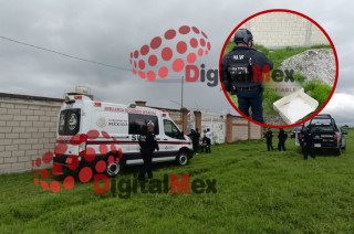 Policías resguardan el lugar donde fue hallado el cuerpo sin vida